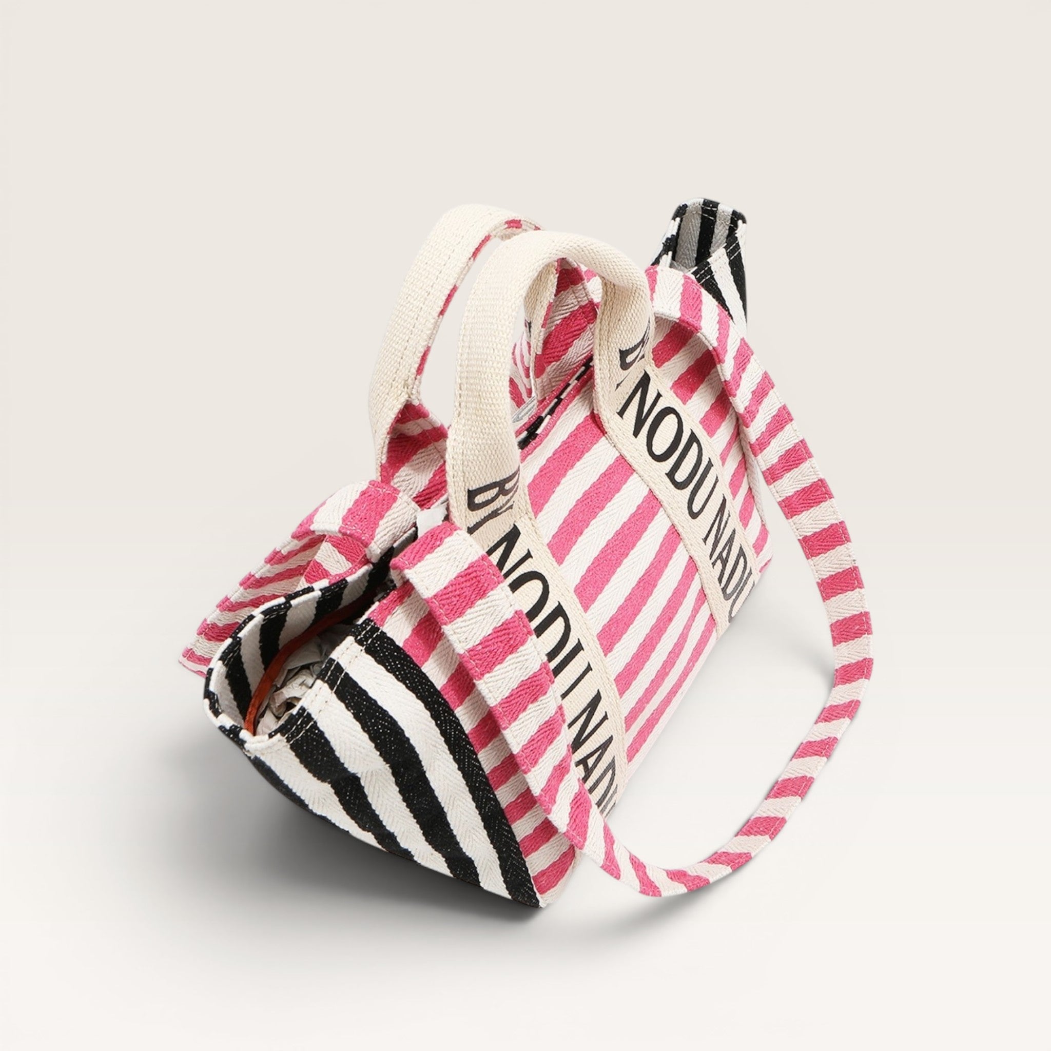 Striped bag with 'NODU' branding on a light gray background