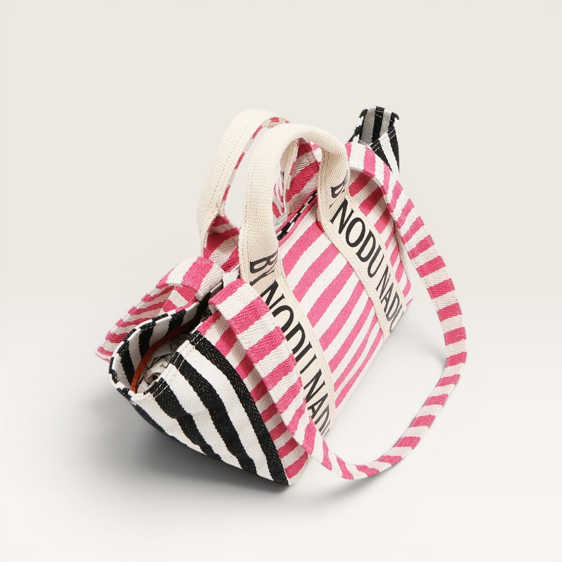 Striped bag with 'NODU' branding on a light gray background