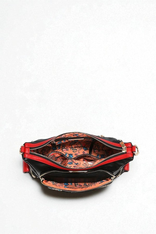 Red handbag with floral interior on a white background