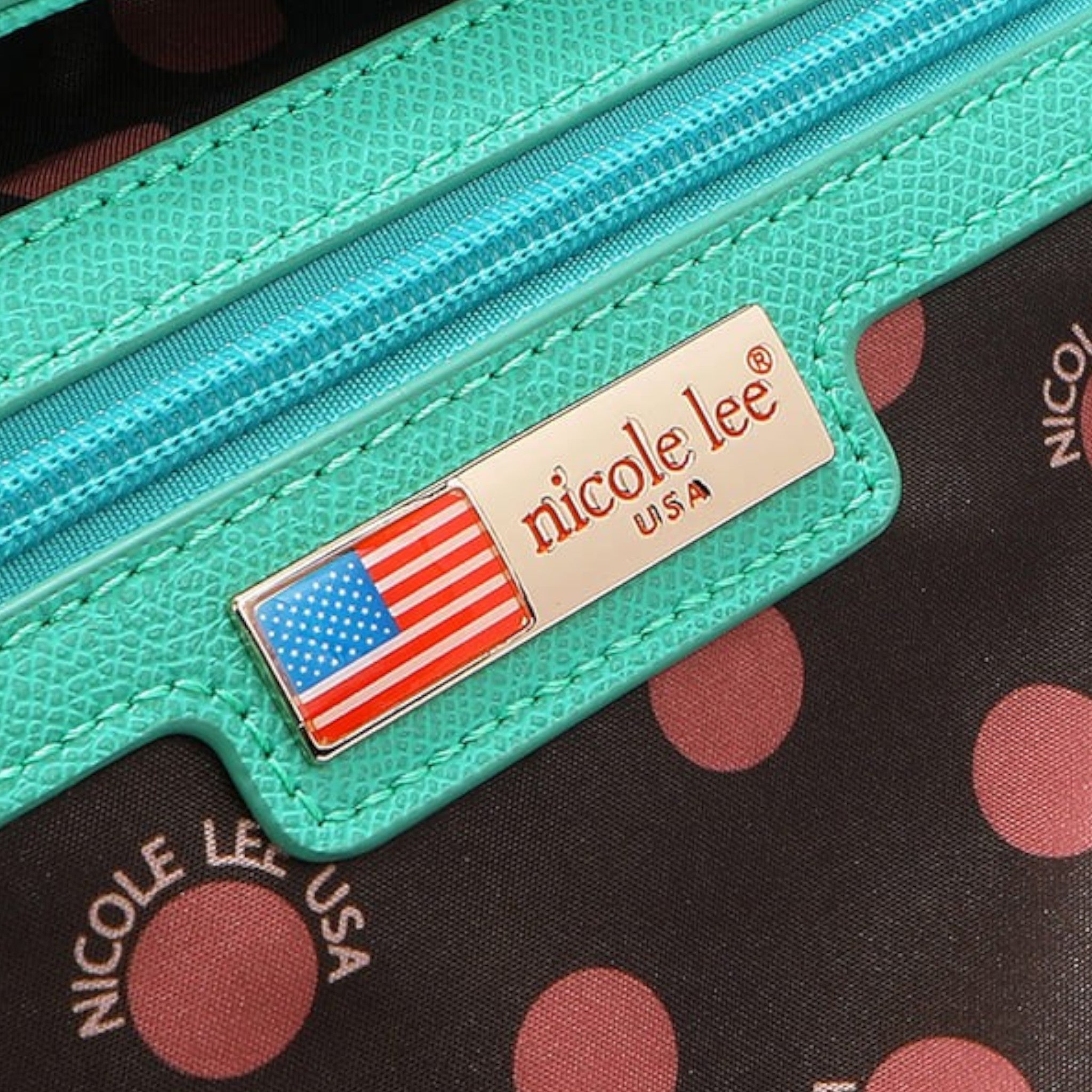 Teal zipper with 'nicole lee' brand name and American flag on a polka dot background
