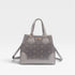 Gray handbag with floral pattern on a light gray background