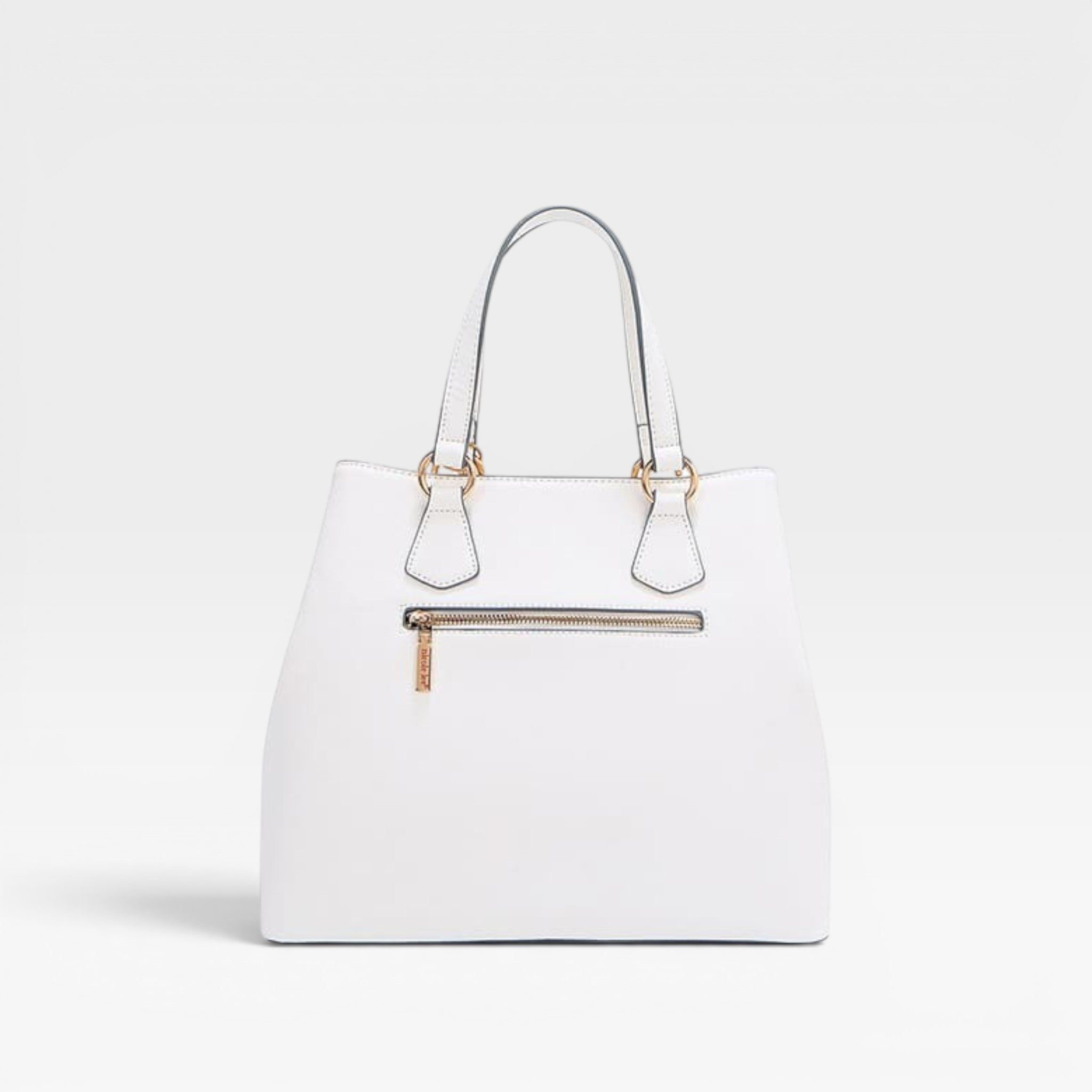 White handbag with gold accents on a light gray background