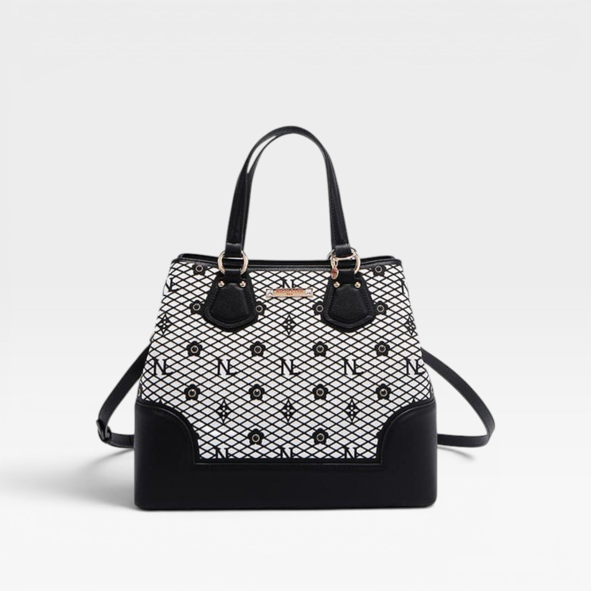 Black and white patterned handbag on a light gray background