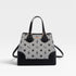 Black and white patterned handbag on a light gray background