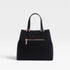 Black handbag with gold zipper on a light gray background