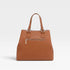 Brown handbag with gold zipper on a light gray background