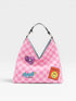 Pink checkered handbag with heart and smiley face patches on a white background