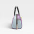 Multicolored handbag with black handles on a light gray background