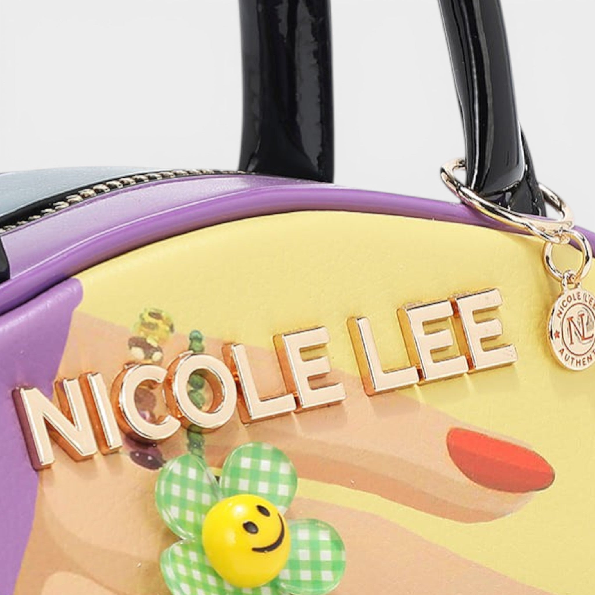 Handbag with 'Nicole Lee' branding and decorative elements on a white background