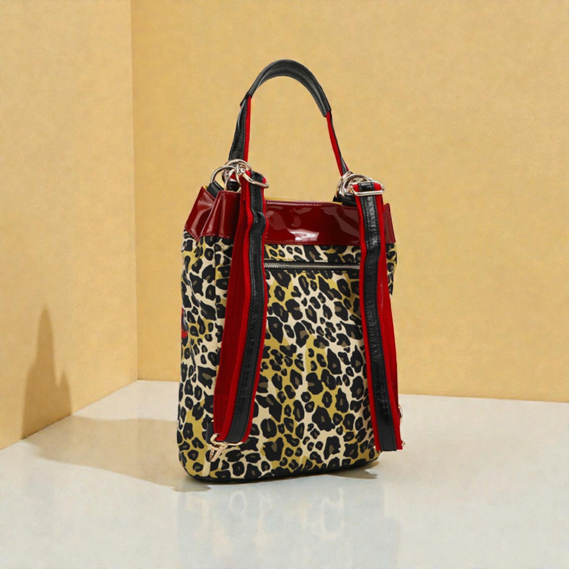 Leopard print handbag with red accents on a beige background