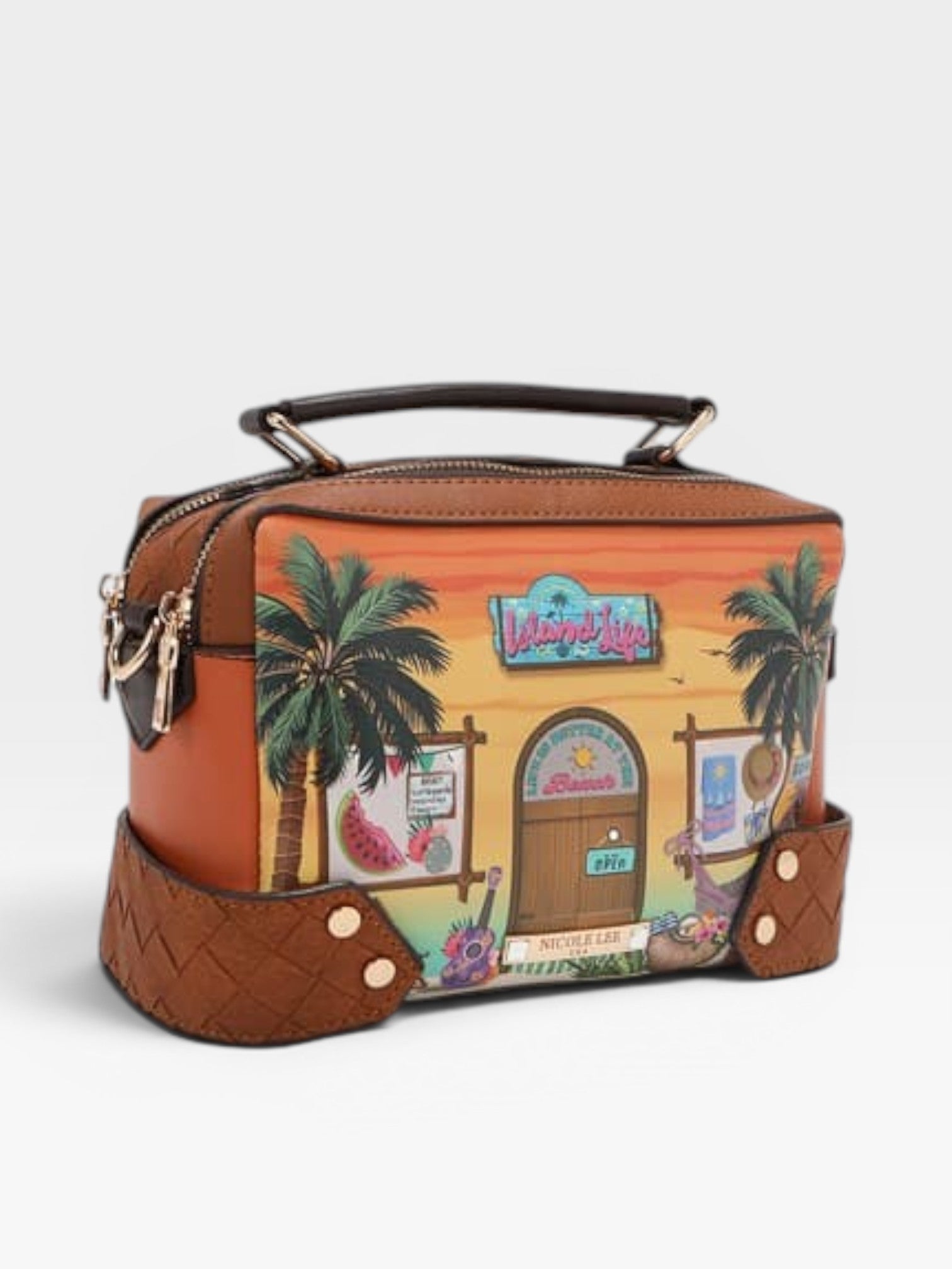 Handbag with tropical design featuring palm trees and a beach scene on a white background