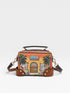 Colorful handbag with a tropical design featuring palm trees and a building on a light gray background.