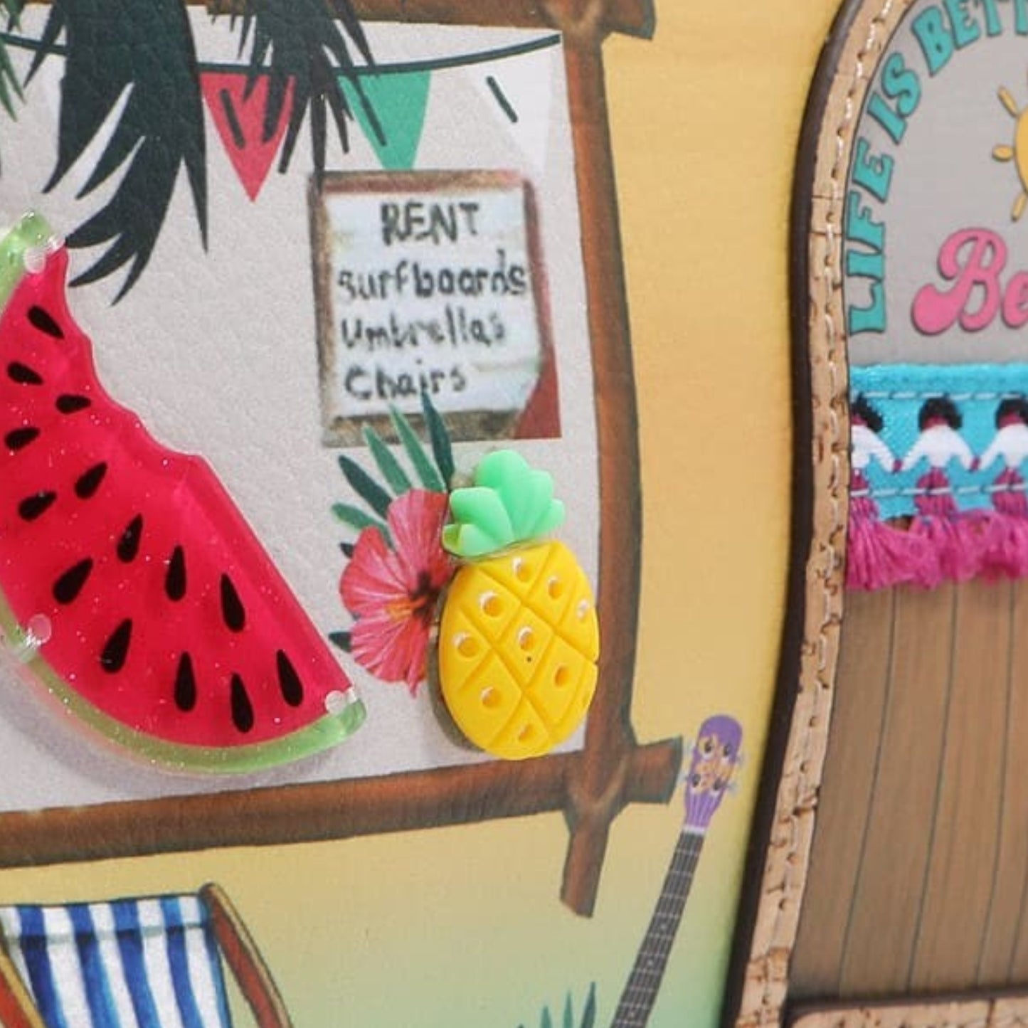 Colorful tropical-themed decor with a watermelon, pineapple, and beach chair.
