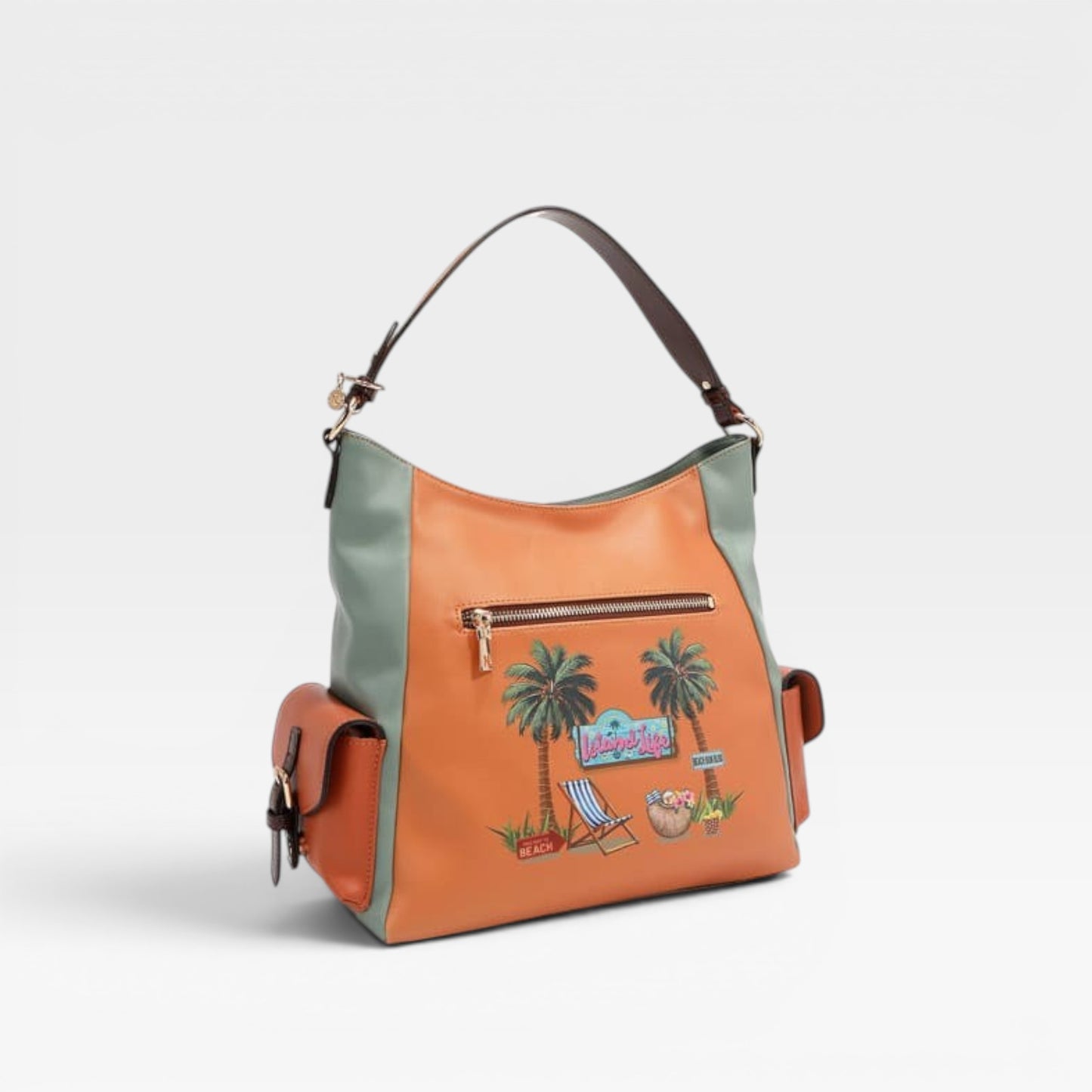 Orange handbag with palm tree design on a light gray background