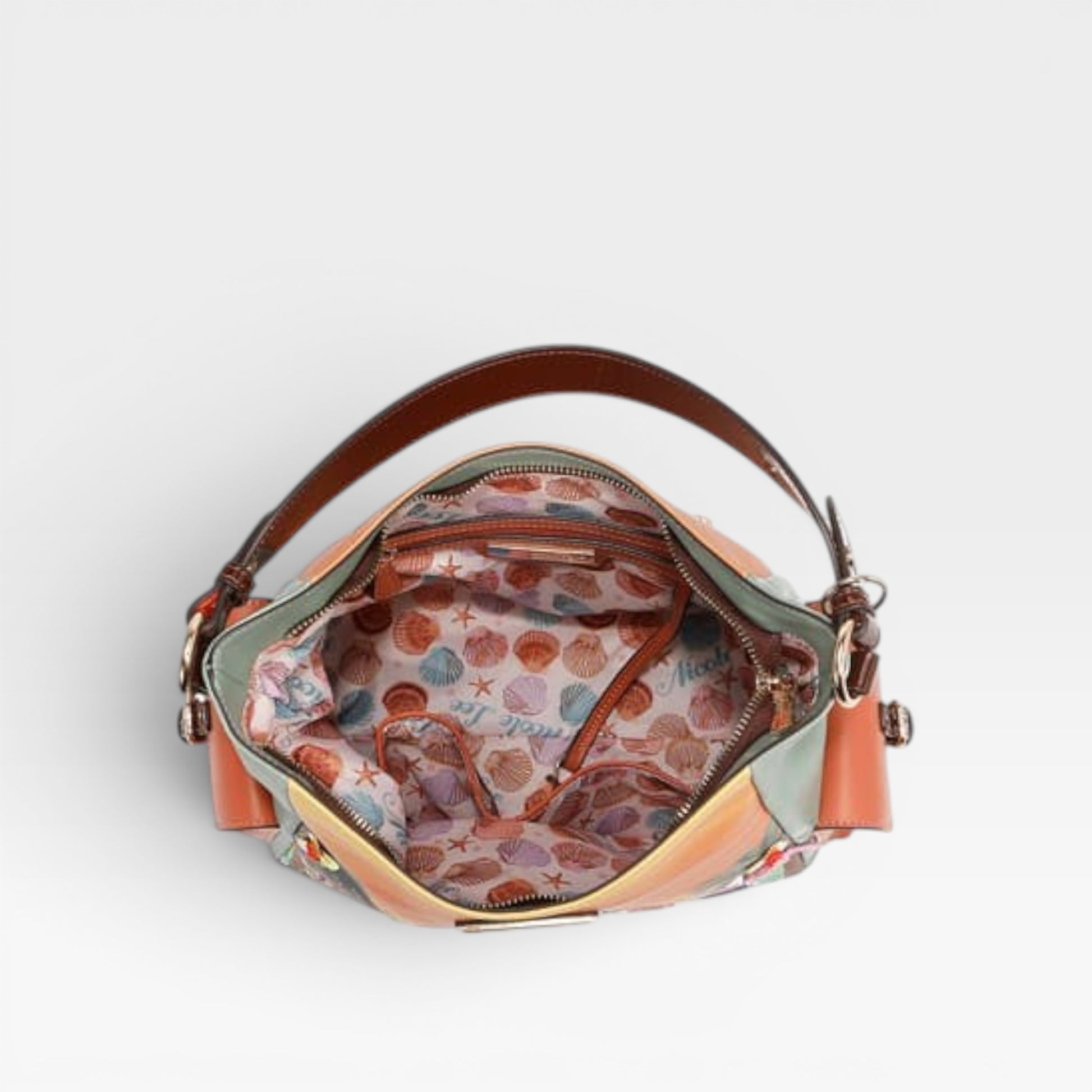 Handbag with a patterned interior on a light gray background
