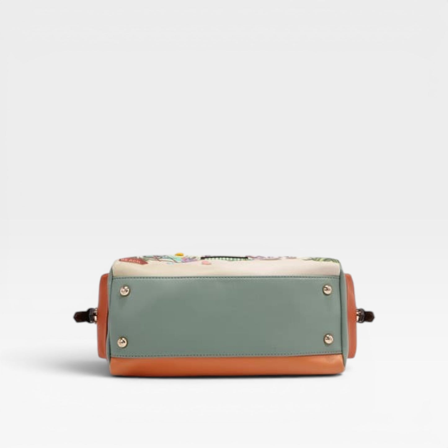 Multicolored handbag with a floral pattern on a light gray background