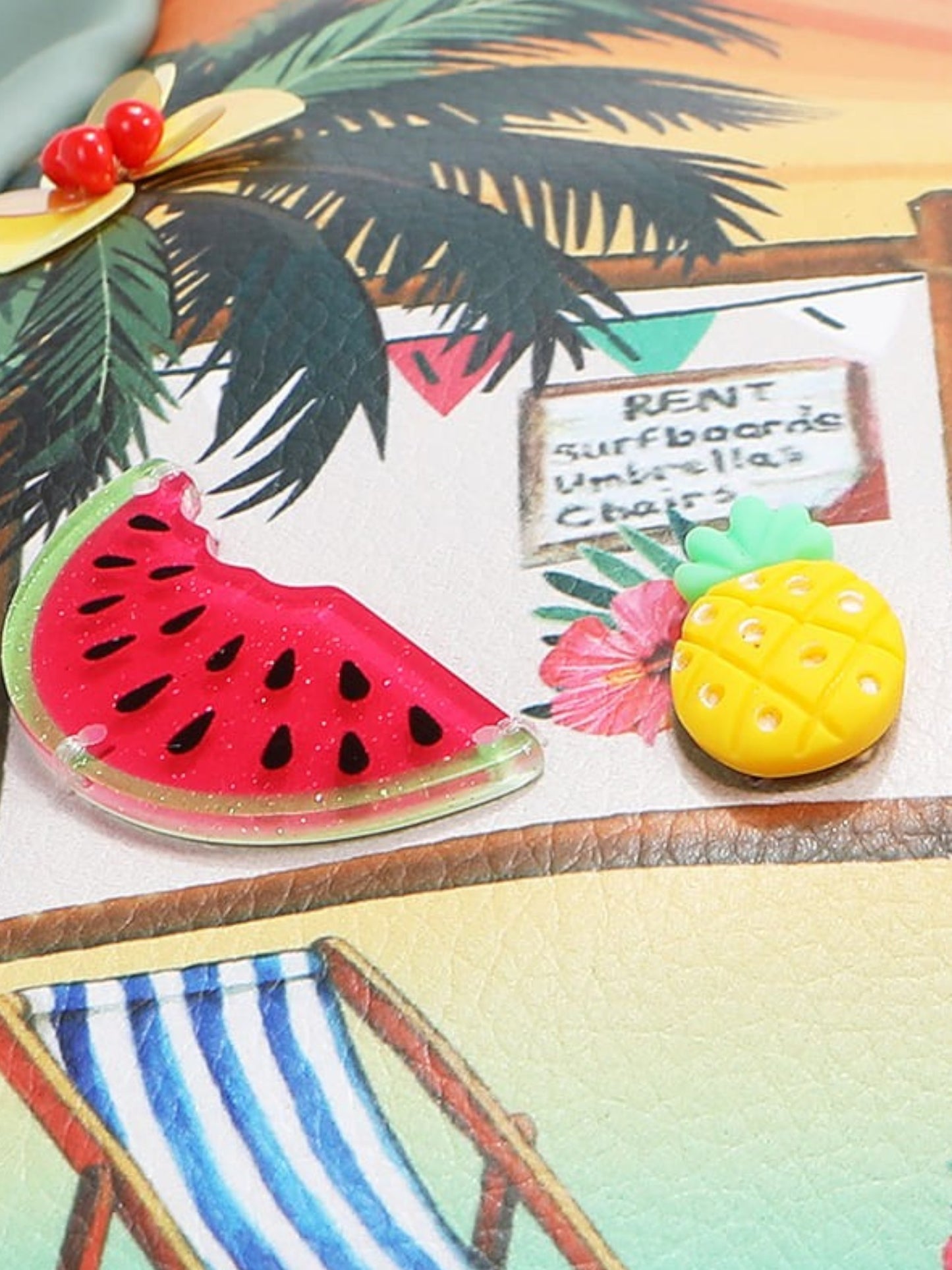 Decorative items including a watermelon slice, pineapple, and beach chair on a tropical-themed background.