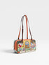 Colorful handbag with a design of a beach scene on a white background