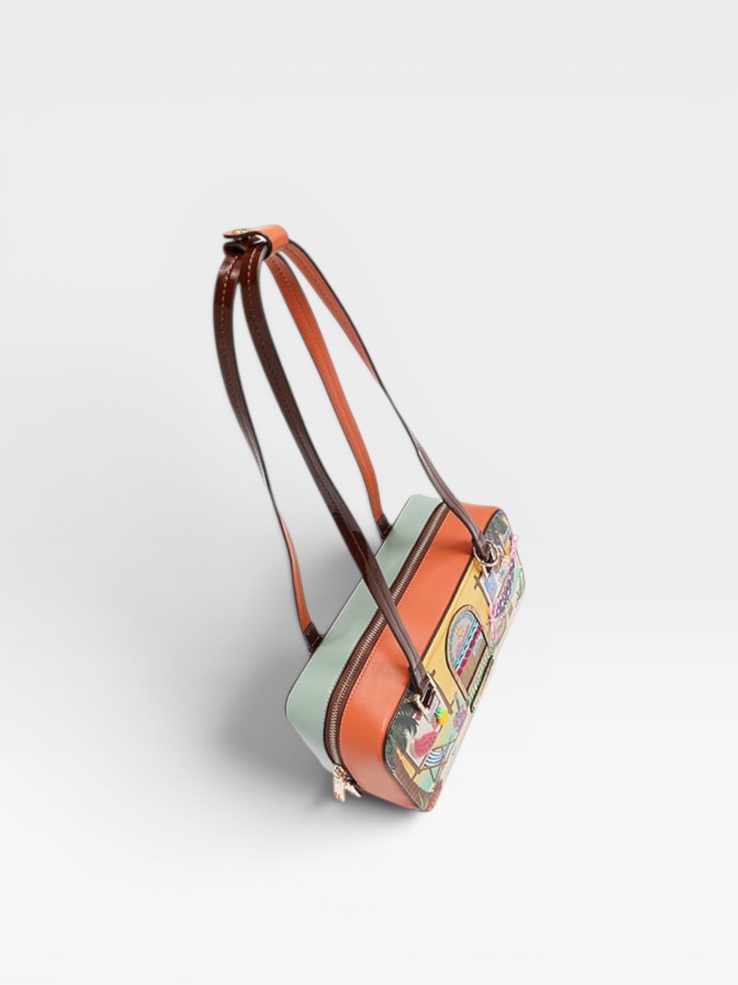 Multicolored handbag with a floral pattern on a light gray background