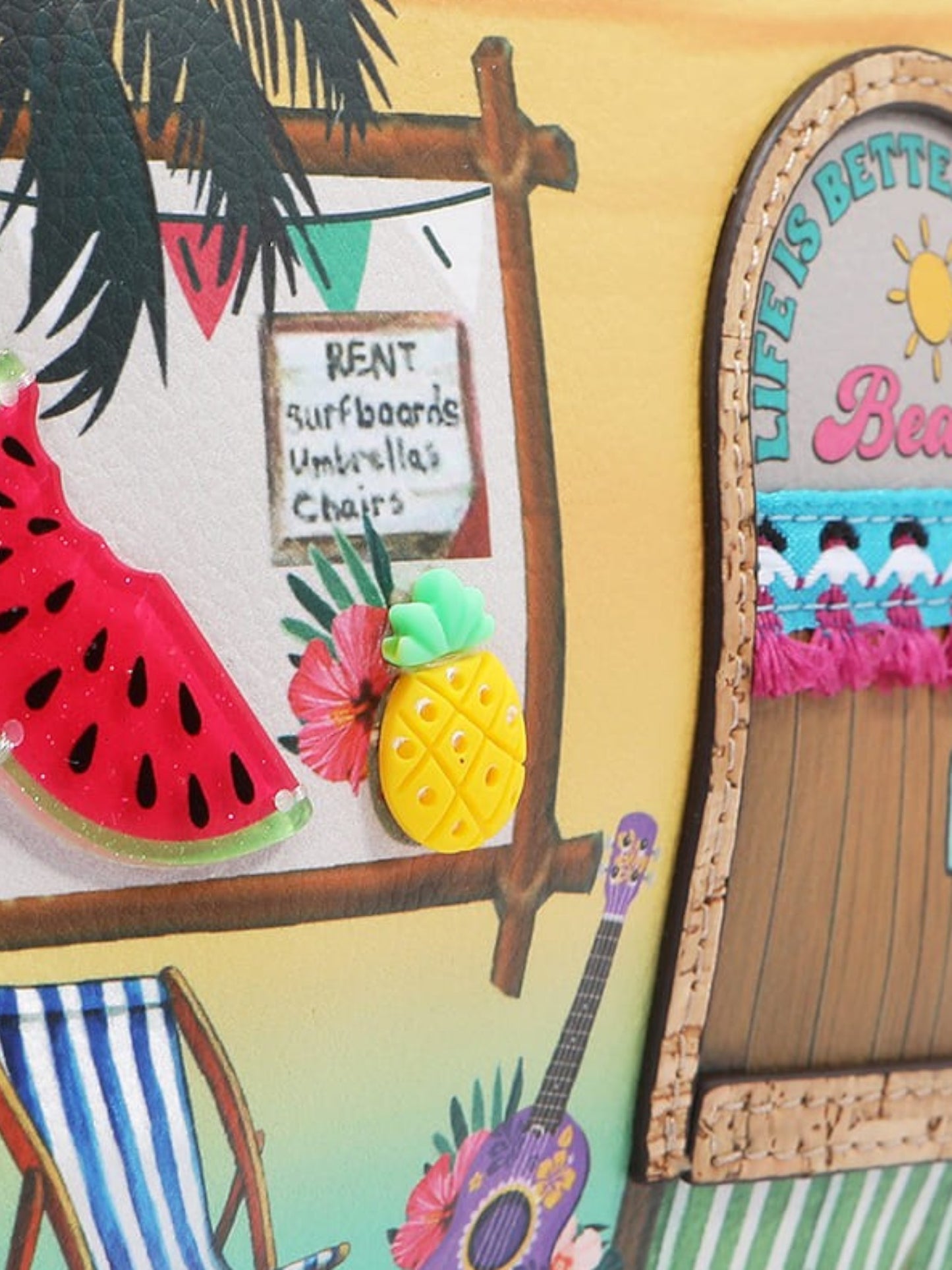 Colorful beach-themed decor with pineapple, surfboard, and 'Life is Better at the Beach' sign.