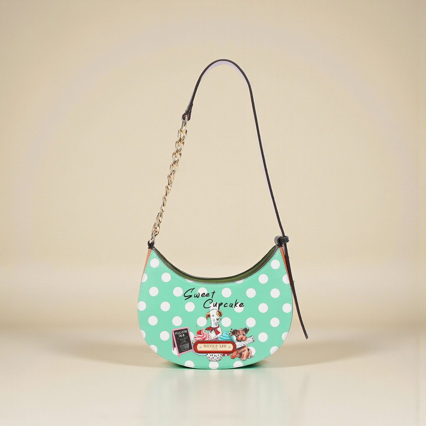 Green polka dot handbag with 'Sweet Cupcake' branding on a beige background