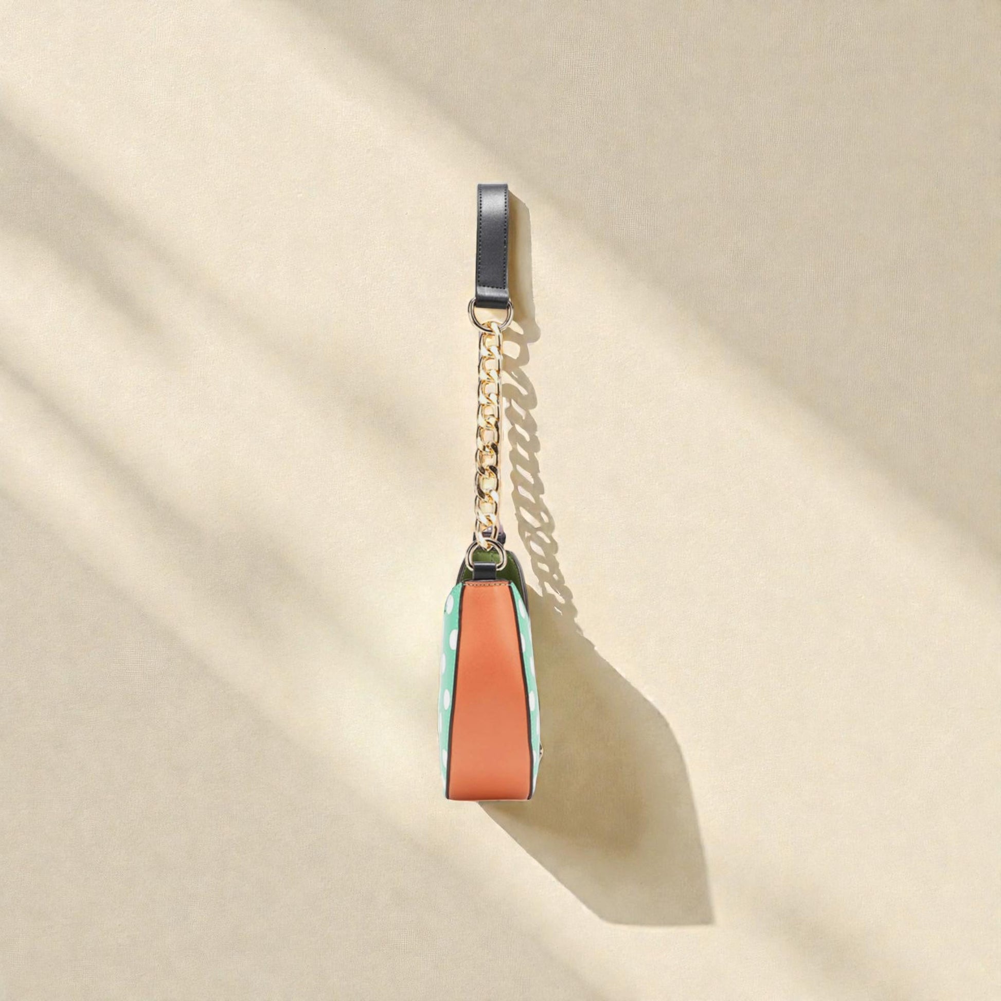 Colorful keychain with a chain on a beige background
