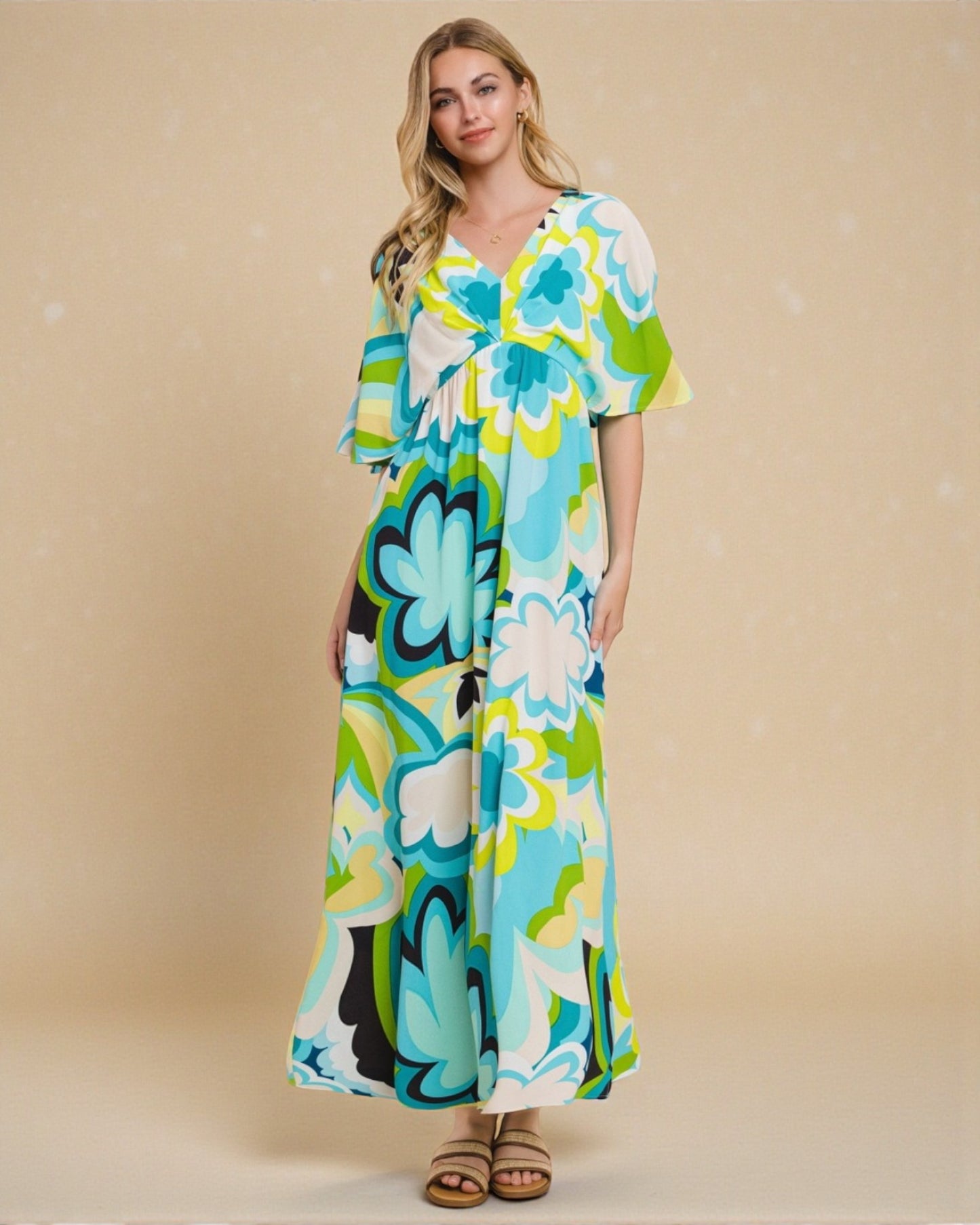 Woman wearing a colorful floral dress against a beige background