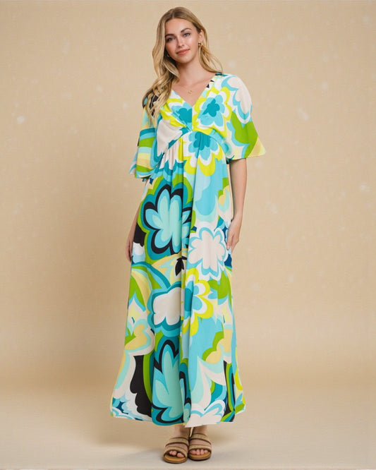 Woman wearing a colorful floral dress against a beige background