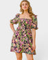 Woman wearing a floral dress on a white background