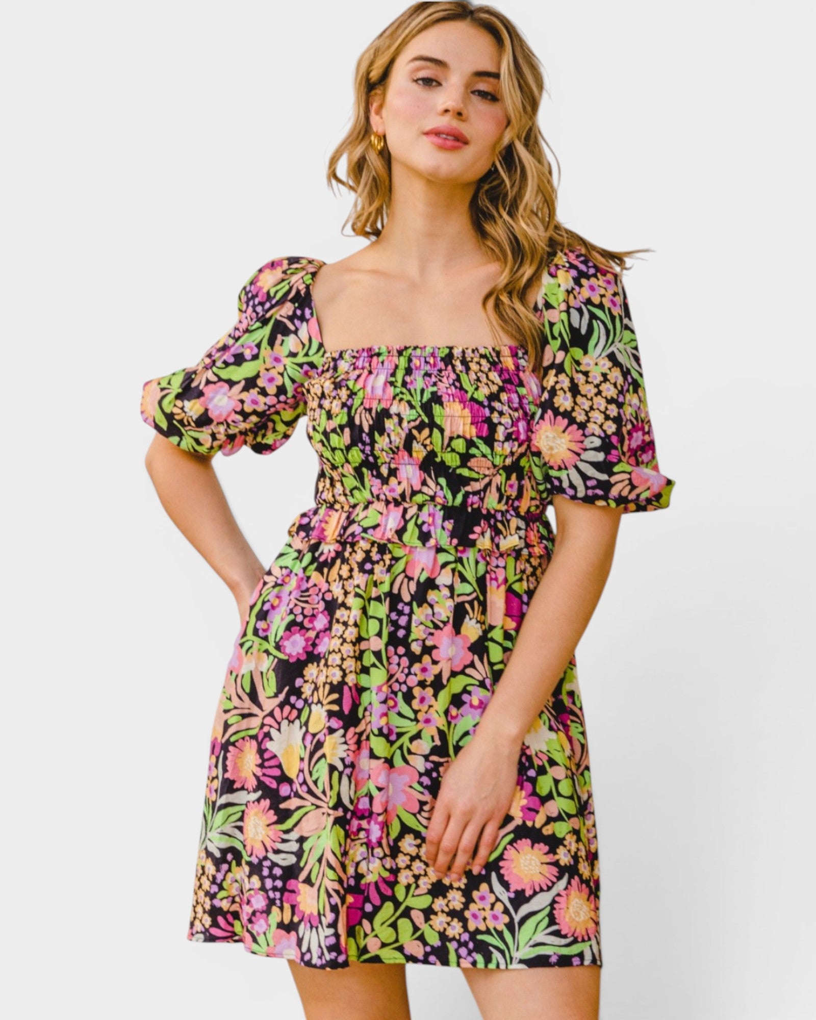 Woman wearing a floral dress on a white background