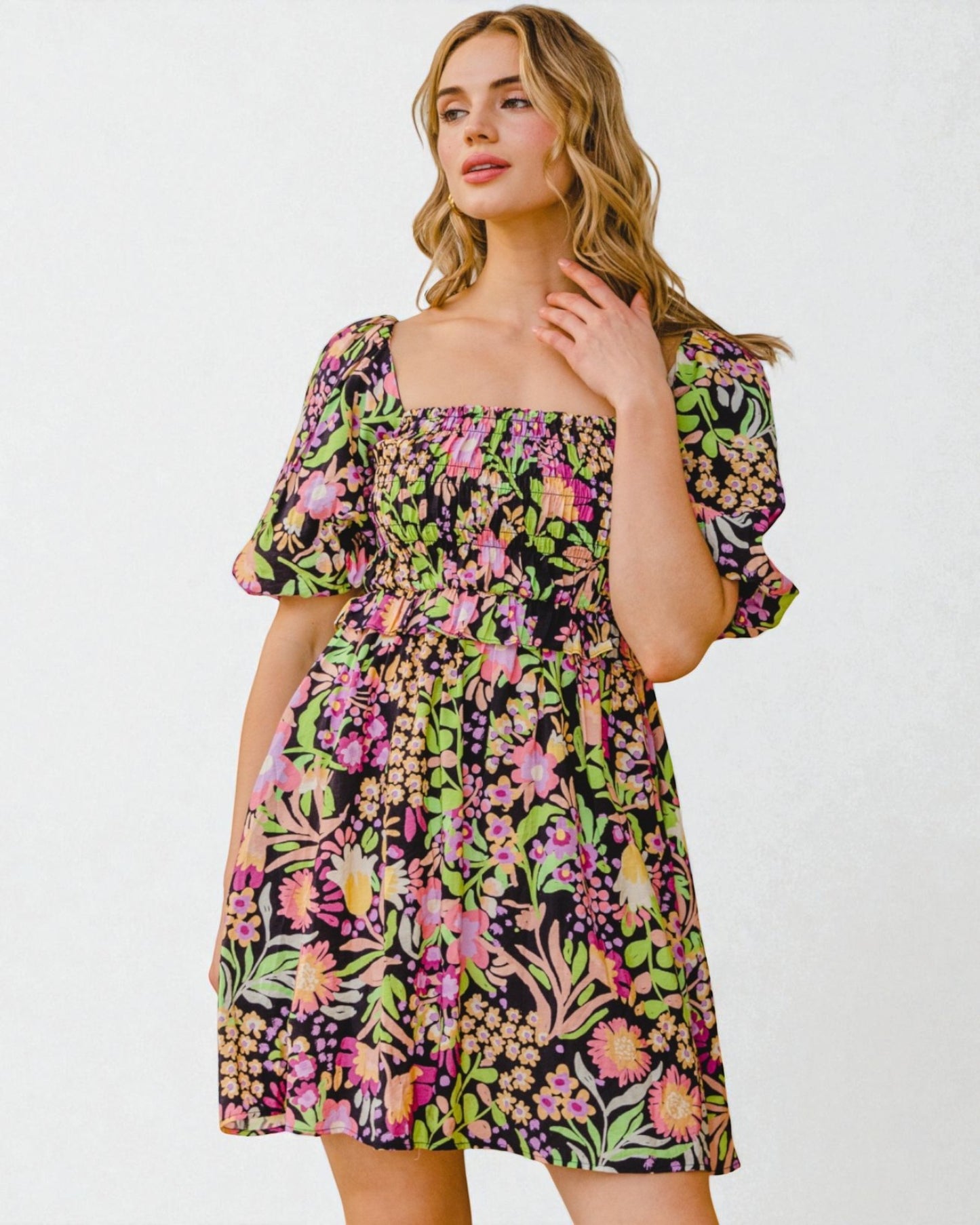 Woman wearing a floral dress on a white background