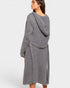 Woman wearing a gray hooded cardigan on a white background