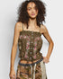 Woman wearing a floral top with a neutral background