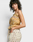 Woman wearing a floral dress with a plain background