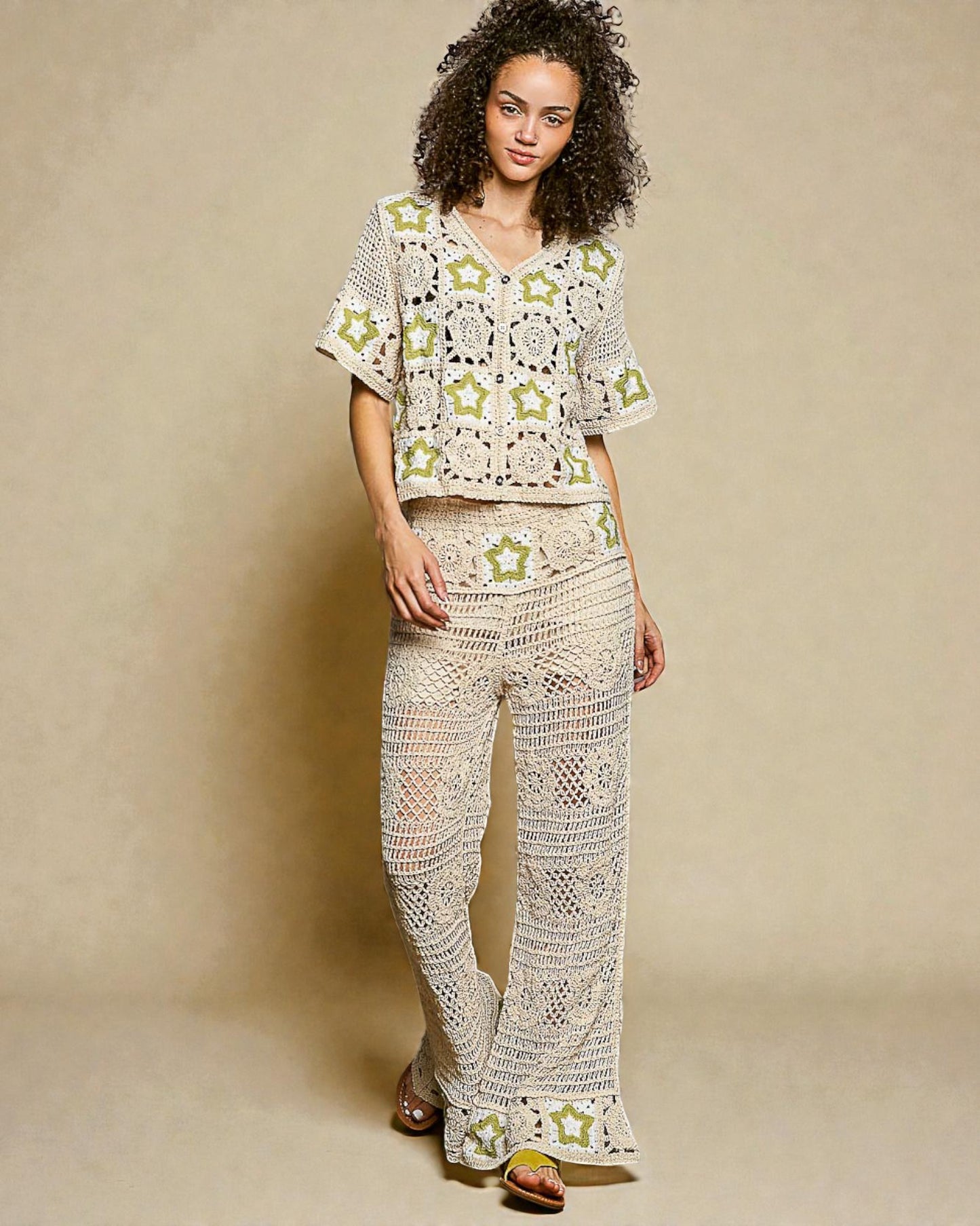 Woman wearing a crochet outfit with star patterns on a beige background