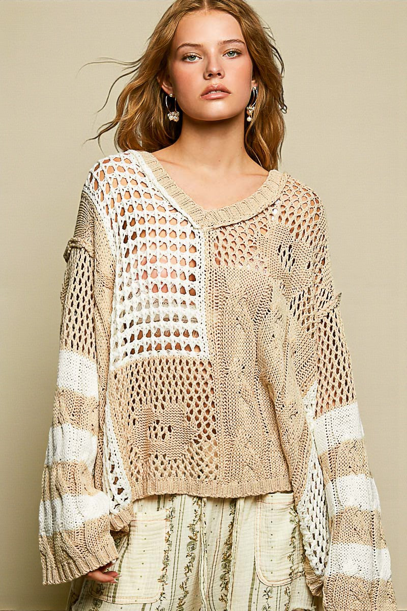 Woman wearing a beige and white crochet top against a beige background