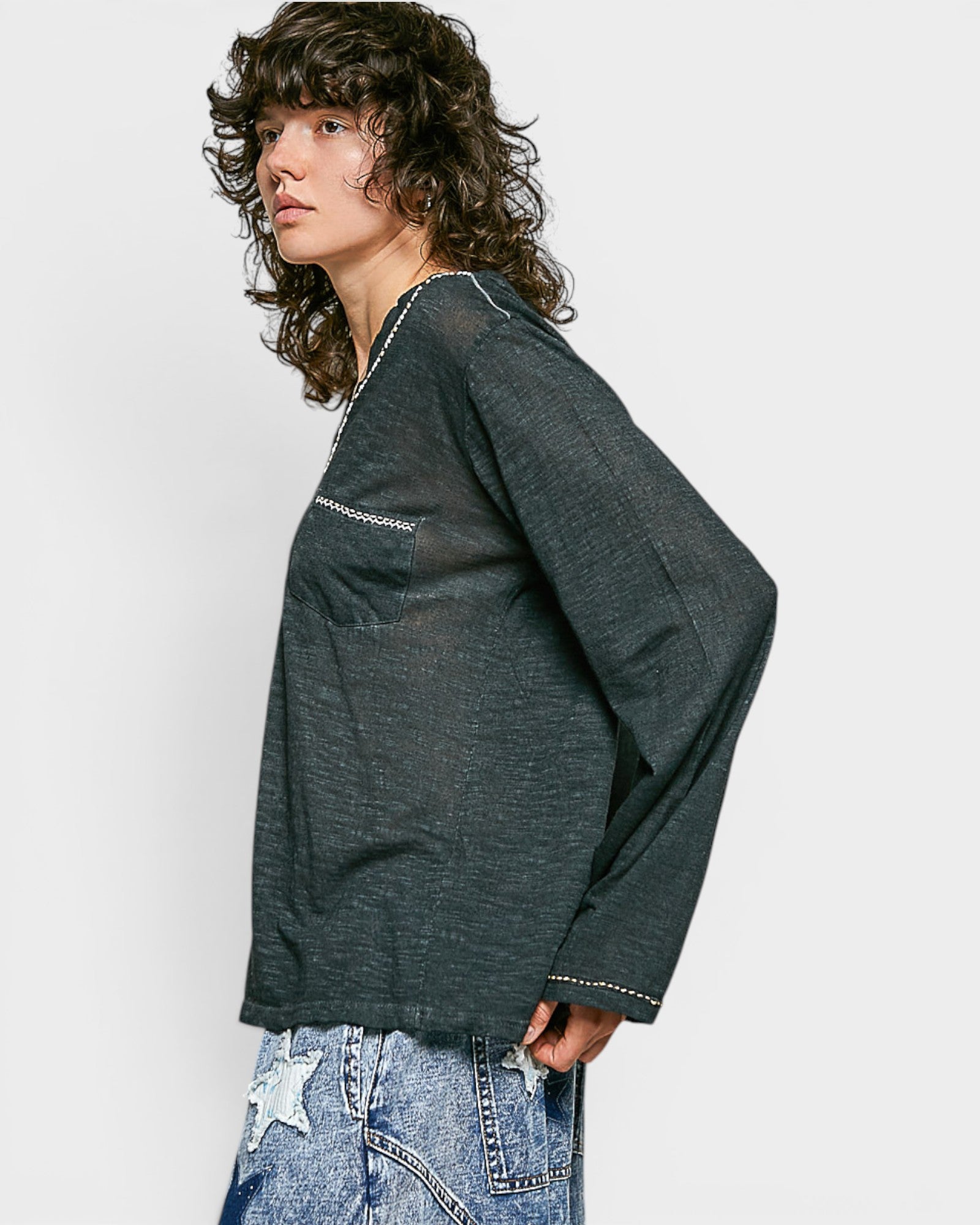 Person wearing a black shirt with a white background