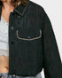Black embroidered jacket with white trim on a plain background