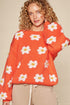 Pull à épaules tombantes et motif marguerites en orange soleil