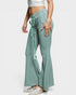 Green checkered pants worn by a person on a white background