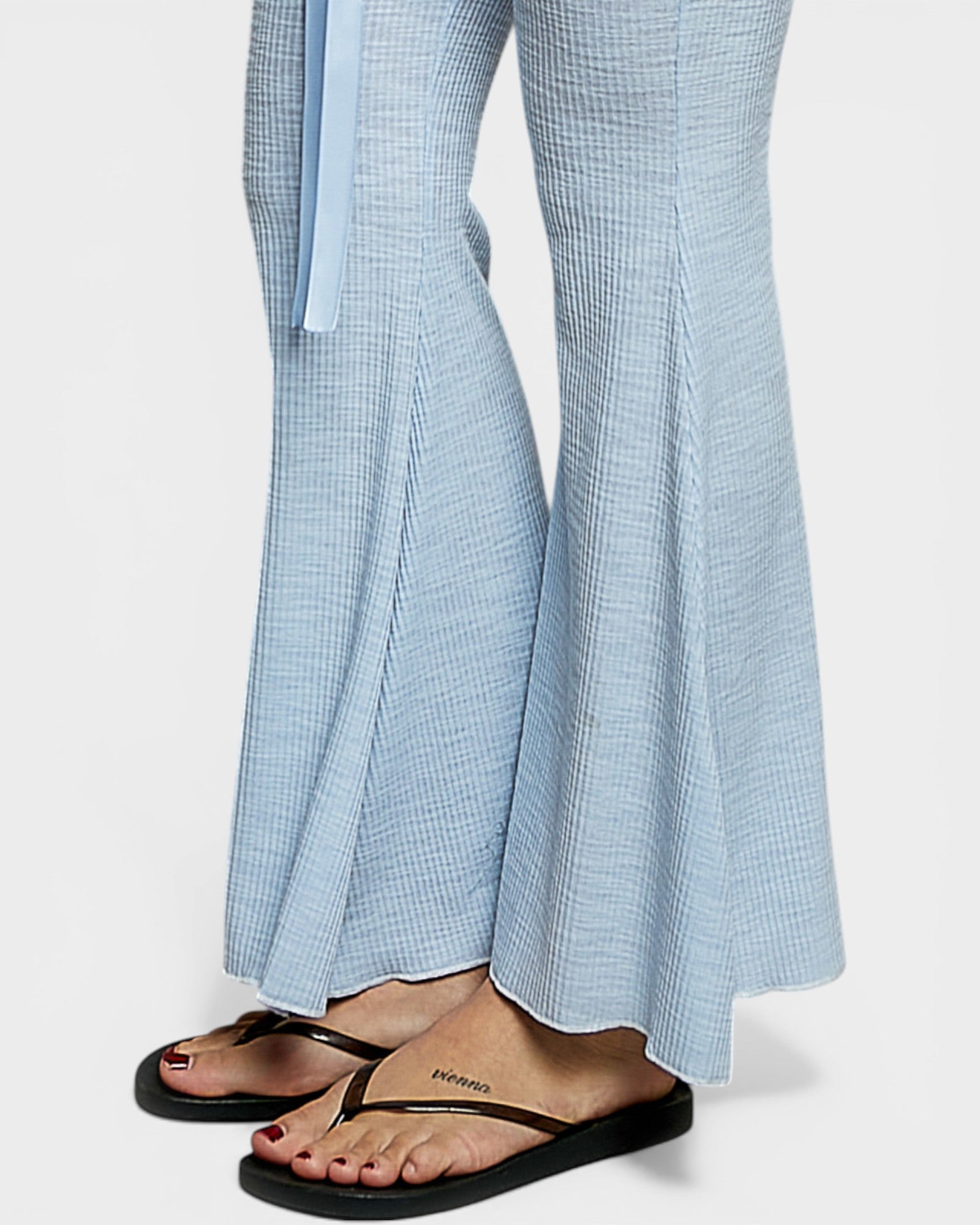 Light blue checkered pants with a white background