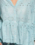 Light blue blouse with intricate eyelet detailing