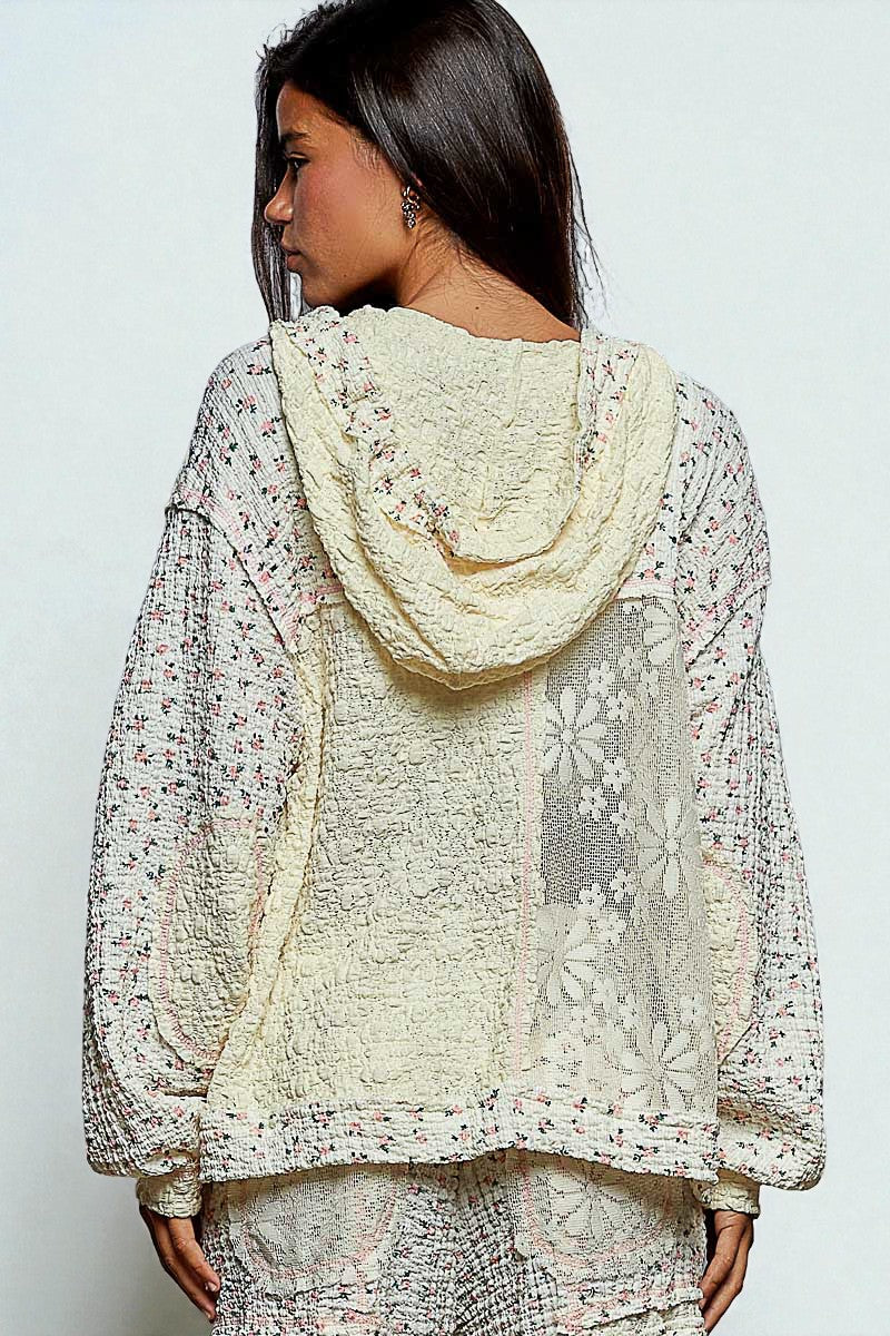 Woman wearing a floral lace outfit with a white background