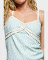 Light blue dress with white lace details on a plain background