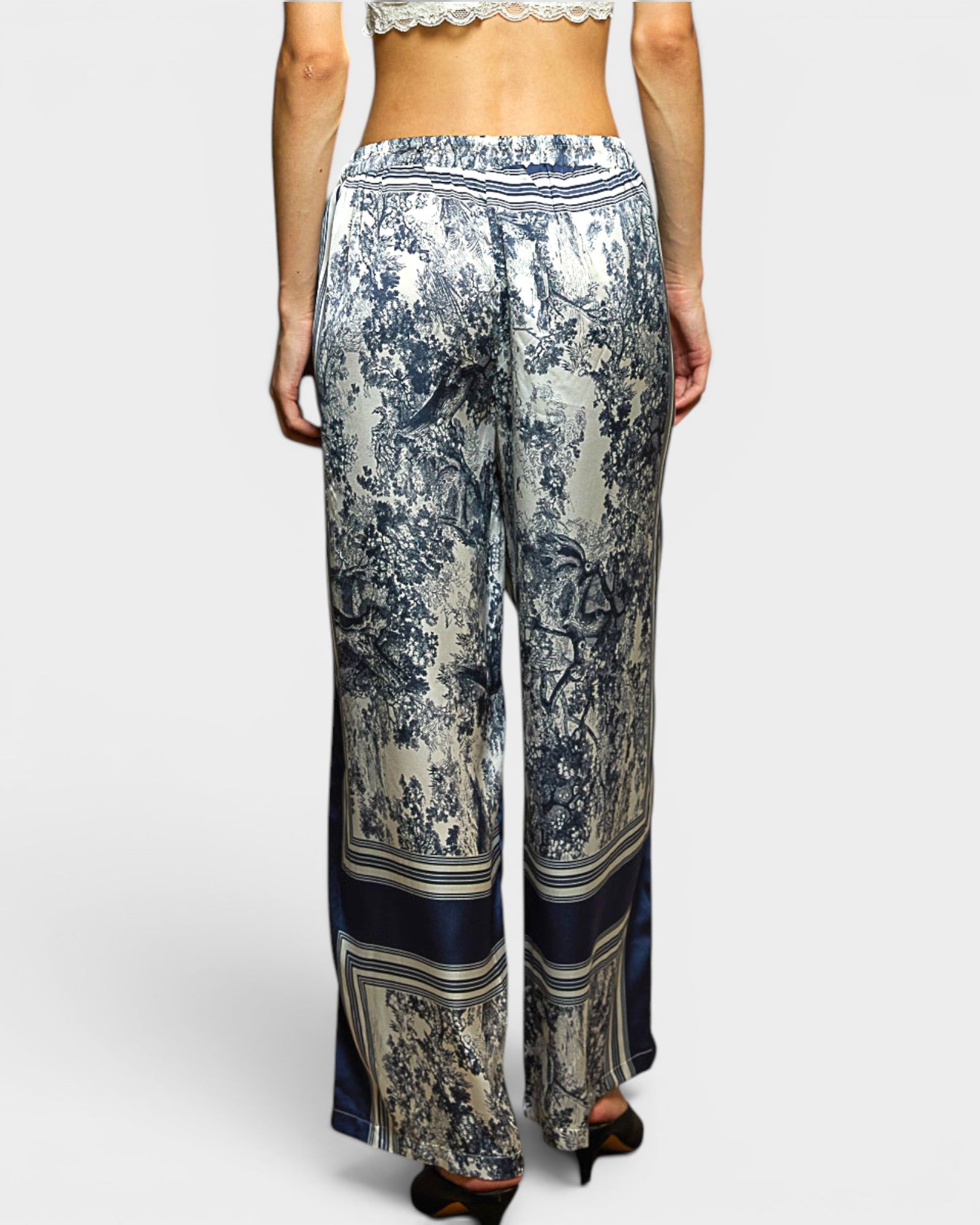 Patterned pants worn by a person on a white background