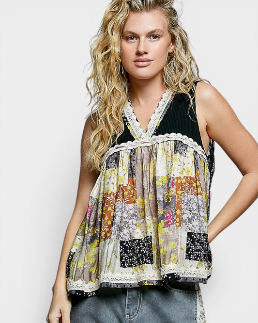 Woman wearing a colorful patchwork sleeveless top against a plain background
