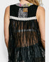 Black lace dress with colorful patchwork neckline on a white background