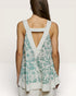 Woman wearing a floral dress with a white background