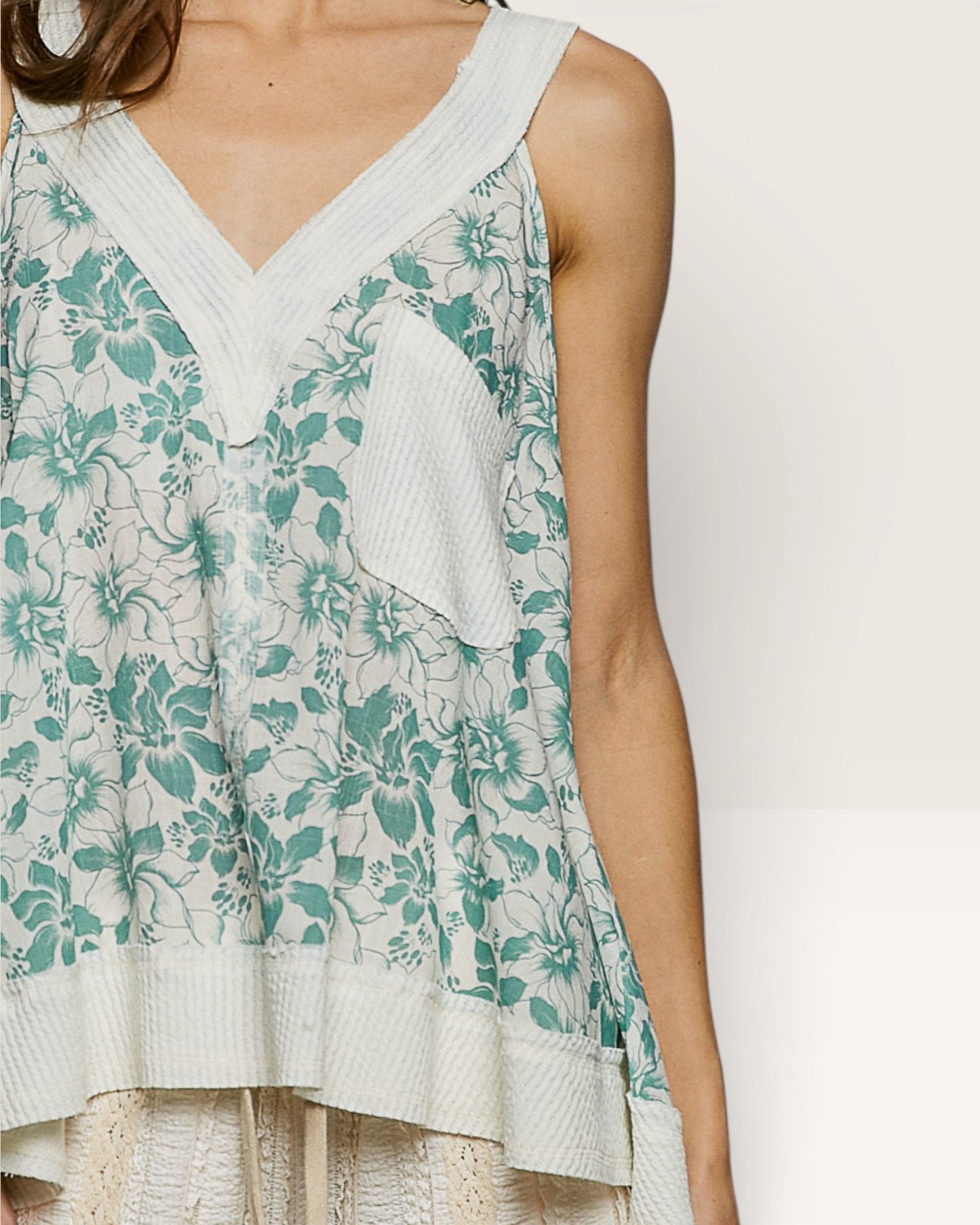 Woman wearing a floral dress with a white background