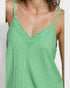 Green tank top with lace detailing on a plain background